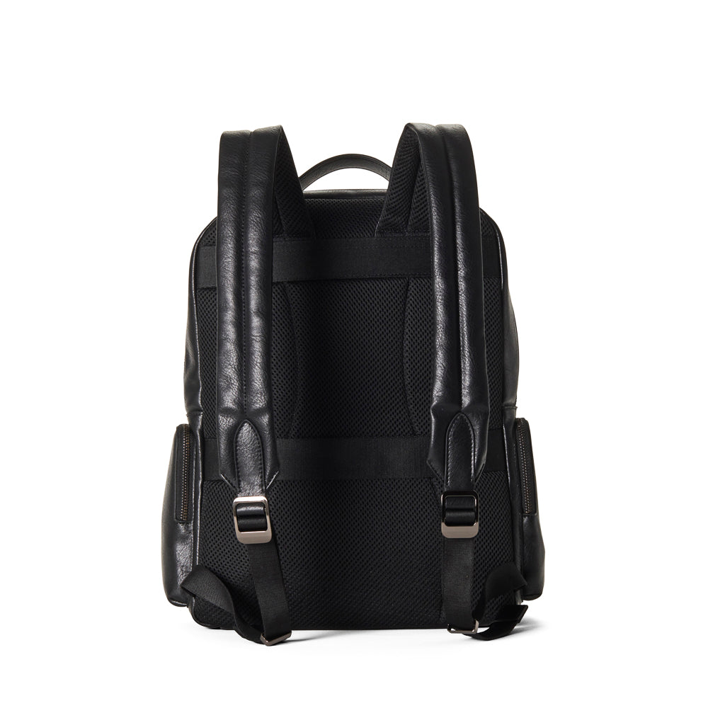 back of black backpack with vegan leather straps on a white background