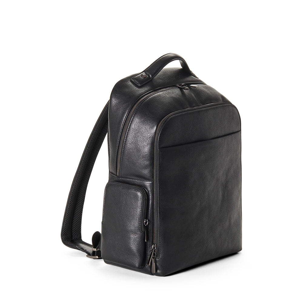 Side shot of black vegan leather backpack on a white background