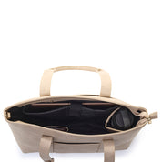 Beige handbag with black interior on a white background