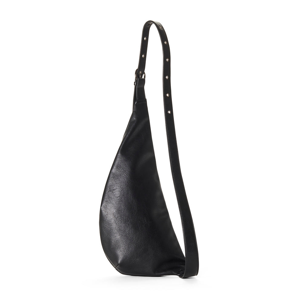 Black leather shoulder belt bag with studded details on a white background