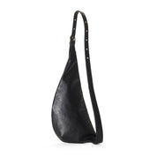 Black leather shoulder belt bag with studded details on a white background