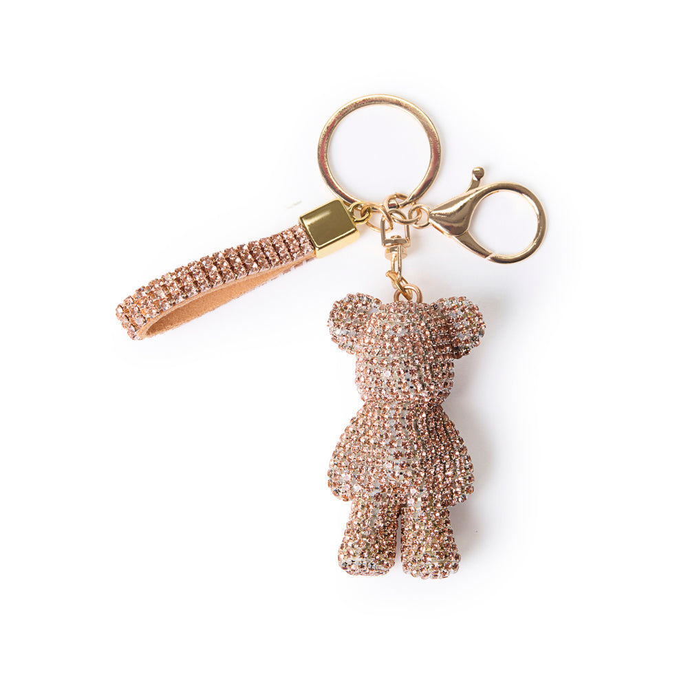 rhinestone bear bag charm rose coloured, on top of white background with gold clasp and keychain ring